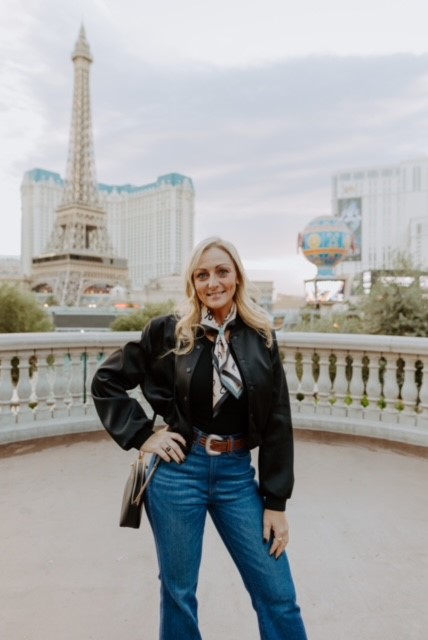 CPA for Photographers Jamie Boyack from Aloha Friday CPA standing in front of the Eiffel Tower in Las Vegas 