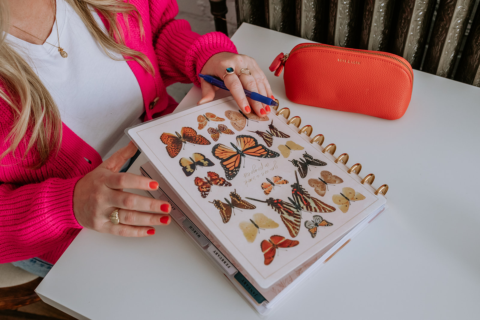 A butterfly planner laying on the desk of CPA for Photographers Jamie Boyack from Aloha Friday CPA 